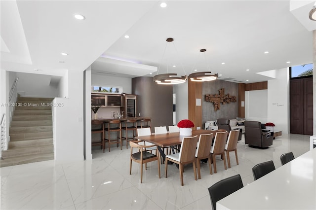 12880 N Bayshore Dr, North Miami, FL 33181 - dining area featuring stairs, recessed lighting, a chandelier, and light marble finish flooring