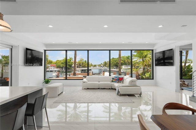 12880 N Bayshore Dr, North Miami, FL 33181 - living area with recessed lighting and light marble finish floors