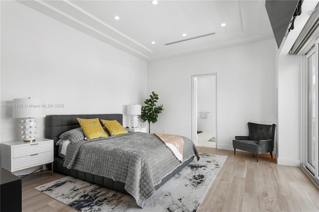 12880 N Bayshore Dr, North Miami, FL 33181 - bedroom featuring light wood-type flooring, recessed lighting, and connected bathroom
