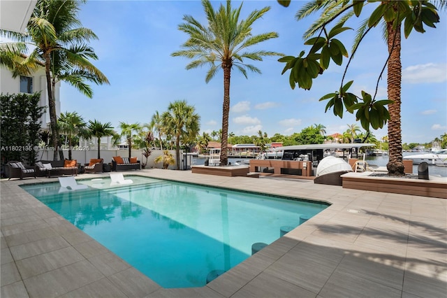 12880 N Bayshore Dr, North Miami, FL 33181 - outdoor pool featuring an outdoor living space and a patio