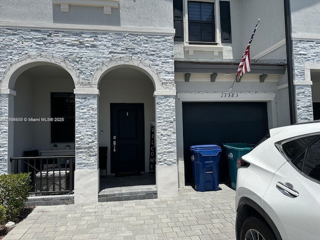 13383 SW 287th Ter, Homestead, FL 33033 - entrance to property with stone siding, stucco siding, and a garage