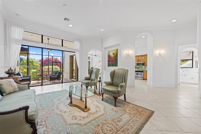 11034 Via, San Remo, Boynton Beach, FL 33437 - living area with light tile patterned floors, ornamental molding, plenty of natural light, recessed lighting, and arched walkways