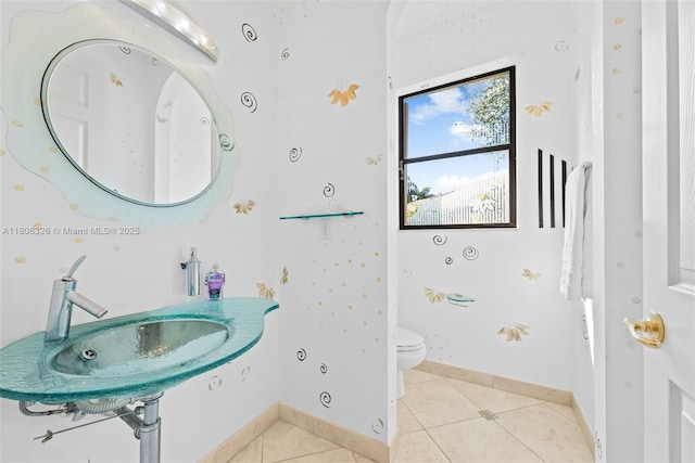11034 Via, San Remo, Boynton Beach, FL 33437 - bathroom featuring a sink, toilet, tile patterned floors, and baseboards