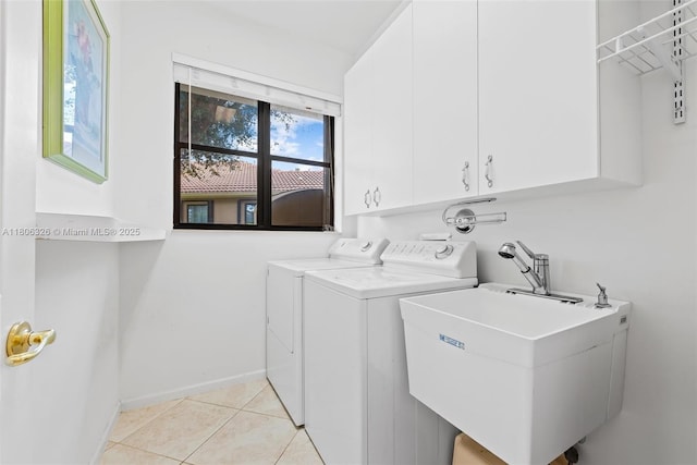11034 Via, San Remo, Boynton Beach, FL 33437 - washroom featuring cabinet space, washer and clothes dryer, light tile patterned floors, and baseboards
