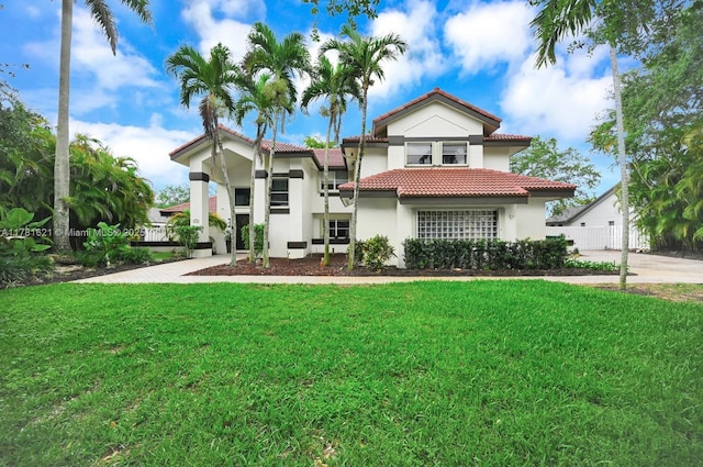 9866 SW 111th Ter, Miami, FL 33176 - mediterranean / spanish-style home with a tile roof, stucco siding, and a front yard