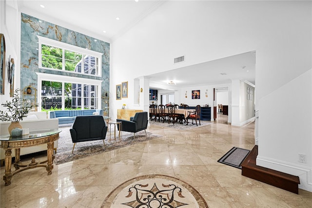 9866 SW 111th Ter, Miami, FL 33176 - living area with a high ceiling, marble tiled floors, ornamental molding, and baseboards