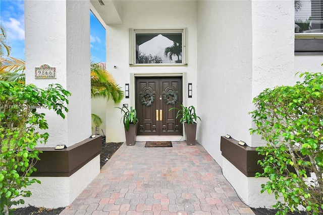 9866 SW 111th Ter, Miami, FL 33176 - doorway to property with stucco siding