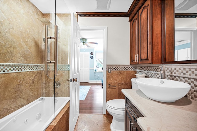 9866 SW 111th Ter, Miami, FL 33176 - bathroom with vanity, a ceiling fan, toilet, a combined bath / shower with jetted tub, and crown molding