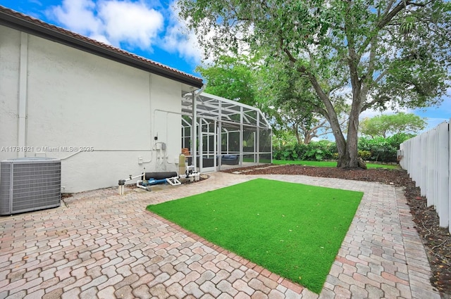 9866 SW 111th Ter, Miami, FL 33176 - fenced backyard featuring central AC unit, a patio area, and a lanai