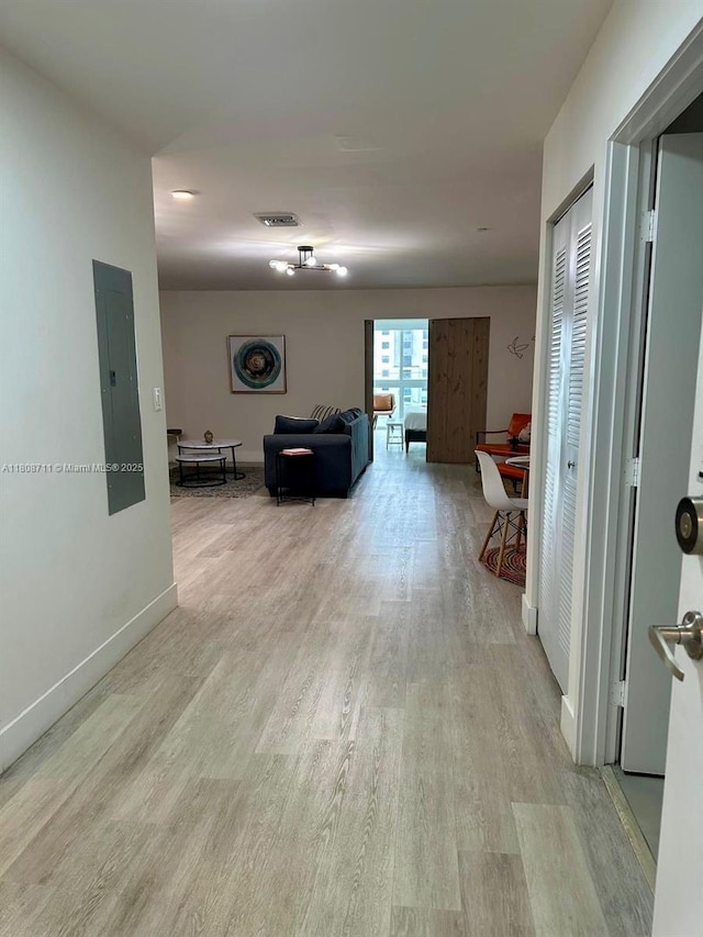 19380 NE 26th Ave Unit 301, Miami, FL 33180 - corridor with electric panel, light wood-type flooring, and baseboards