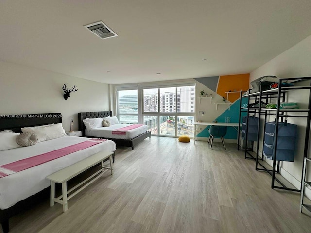 19380 NE 26th Ave Unit 305, Miami, FL 33180 - bedroom with wood finished floors