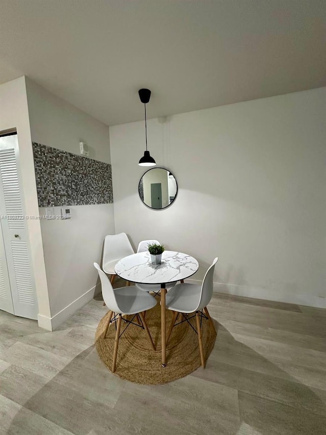 19380 NE 26th Ave Unit 305, Miami, FL 33180 - dining room featuring baseboards