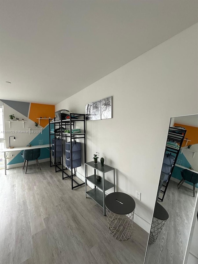 19380 NE 26th Ave Unit 305, Miami, FL 33180 - staircase featuring wood finished floors and baseboards