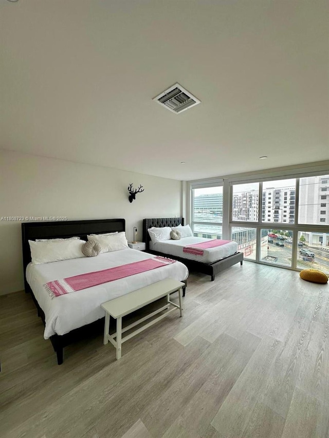 19380 NE 26th Ave Unit 305, Miami, FL 33180 - bedroom featuring wood finished floors