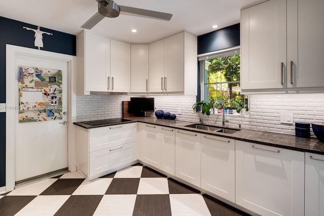 3245 Riviera Dr, Coral Gables, FL 33134 - kitchen with a sink, a ceiling fan, white cabinetry, decorative backsplash, and recessed lighting
