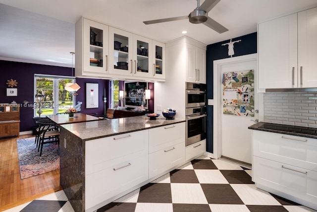 3245 Riviera Dr, Coral Gables, FL 33134 - kitchen featuring a ceiling fan, recessed lighting, a peninsula, backsplash, and white cabinets