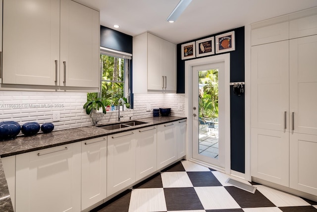 3245 Riviera Dr, Coral Gables, FL 33134 - kitchen with a sink, healthy amount of natural light, decorative backsplash, and recessed lighting
