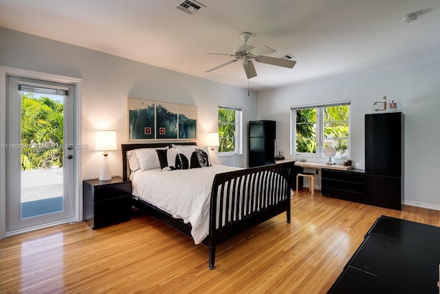 3245 Riviera Dr, Coral Gables, FL 33134 - bedroom with access to exterior, light wood-style floors, an office area, and ceiling fan