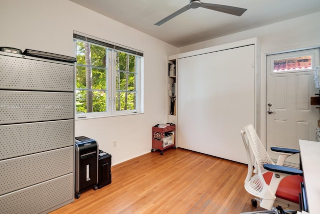 3245 Riviera Dr, Coral Gables, FL 33134 - unfurnished office with ceiling fan, light wood-style flooring, and baseboards
