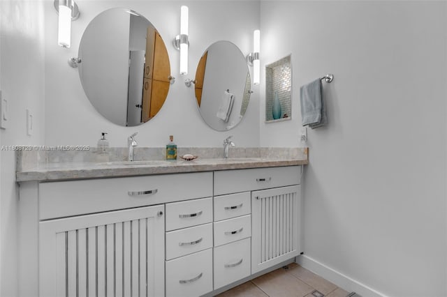 101 Ocean Lane Dr Unit 4012, Key Biscayne, FL 33149 - bathroom with double vanity, tile patterned flooring, and baseboards