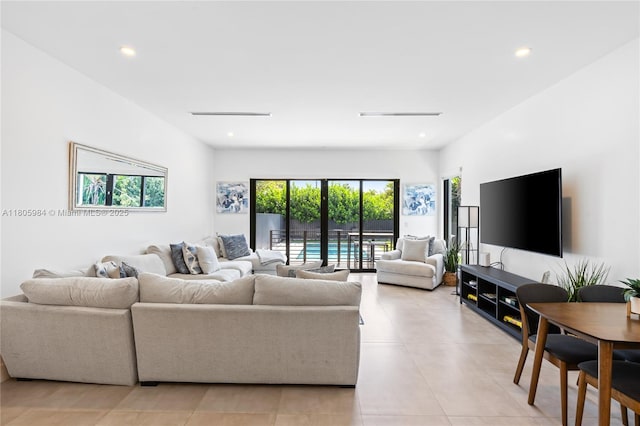 1116 NE 10th Ave, Fort Lauderdale, FL 33304 - living area with recessed lighting and light tile patterned flooring