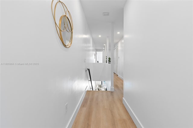1116 NE 10th Ave, Fort Lauderdale, FL 33304 - hallway featuring an upstairs landing, baseboards, light wood-type flooring, and recessed lighting