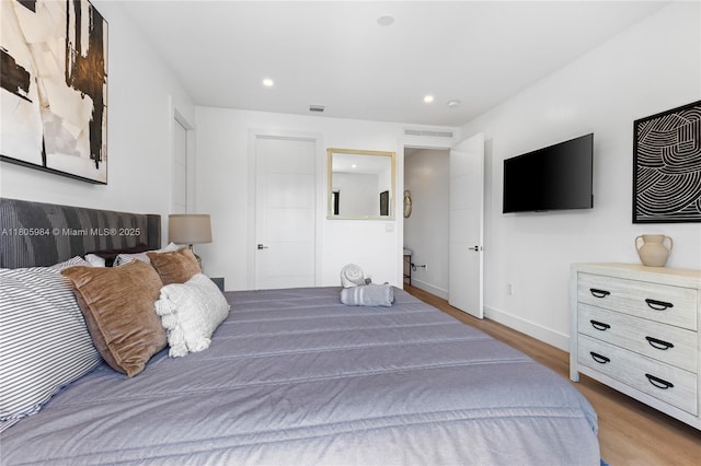 1116 NE 10th Ave, Fort Lauderdale, FL 33304 - bedroom with wood finished floors, baseboards, and recessed lighting