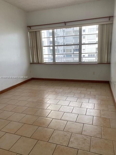 18061 Biscayne Blvd Unit Ph02, Aventura, FL 33160 - empty room featuring plenty of natural light