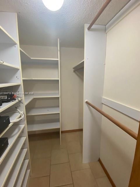 18061 Biscayne Blvd Unit Ph02, Aventura, FL 33160 - spacious closet with tile patterned floors