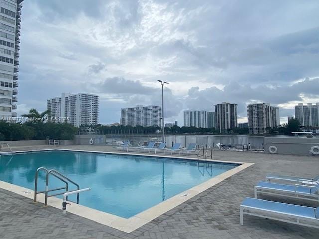 18061 Biscayne Blvd Unit Ph02, Aventura, FL 33160 - community pool with a view of city and a patio