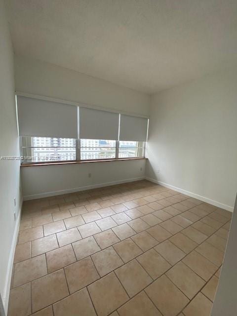 18061 Biscayne Blvd Unit Ph02, Aventura, FL 33160 - unfurnished room with tile patterned floors and baseboards