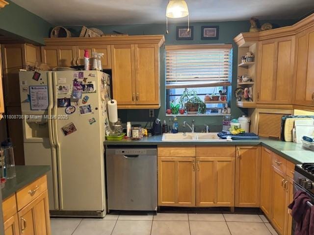 9301 SW 16th St, Miami, FL 33165 - kitchen with dishwasher, a sink, light tile patterned floors, freestanding refrigerator, and range with gas stovetop