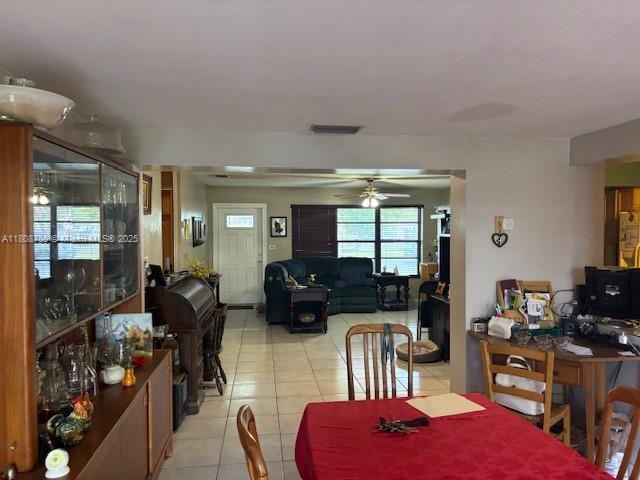 9301 SW 16th St, Miami, FL 33165 - dining space with light tile patterned floors and ceiling fan