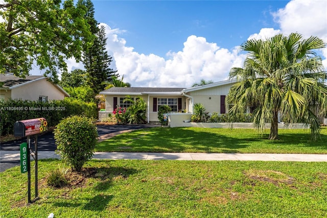 9362 NW 24th Pl, Sunrise, FL 33322 - ranch-style home featuring a front lawn and stucco siding