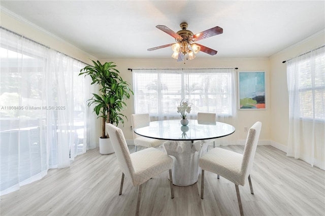 9362 NW 24th Pl, Sunrise, FL 33322 - dining room with light wood-type flooring, baseboards, crown molding, and ceiling fan