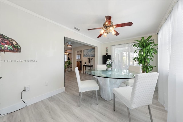 9362 NW 24th Pl, Sunrise, FL 33322 - dining room with a ceiling fan, wood finished floors, baseboards, and crown molding