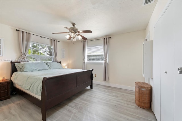 9362 NW 24th Pl, Sunrise, FL 33322 - bedroom featuring baseboards, light wood-type flooring, and a ceiling fan