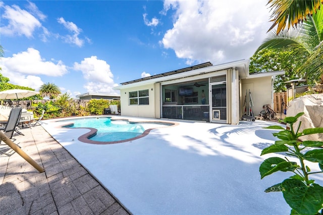 9362 NW 24th Pl, Sunrise, FL 33322 - view of swimming pool featuring a sunroom, a patio, a fenced backyard, and a ceiling fan