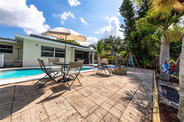 9362 NW 24th Pl, Sunrise, FL 33322 - view of pool with an outdoor fire pit and a patio area