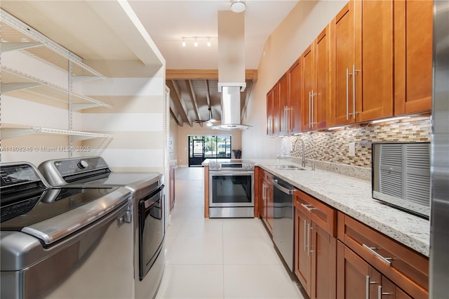 10760 Hickory Ave, Pembroke Pines, FL 33026 - kitchen with stainless steel appliances, a sink, separate washer and dryer, tasteful backsplash, and light stone counters