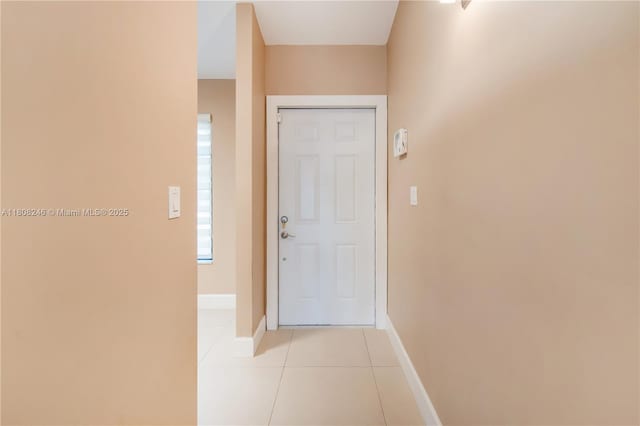 10760 Hickory Ave, Pembroke Pines, FL 33026 - foyer featuring light tile patterned floors and baseboards