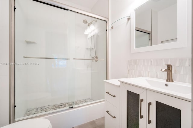 10760 Hickory Ave, Pembroke Pines, FL 33026 - full bathroom featuring vanity, a shower stall, backsplash, and toilet