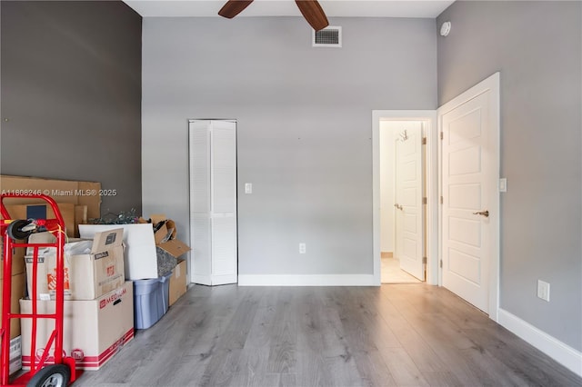 10760 Hickory Ave, Pembroke Pines, FL 33026 - bedroom with wood finished floors, a towering ceiling, ceiling fan, beam ceiling, and a closet
