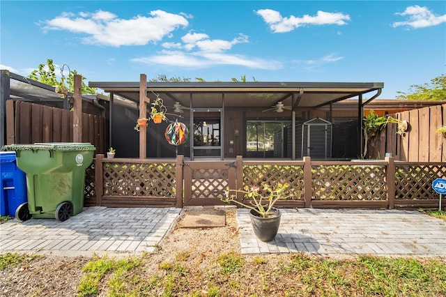 10760 Hickory Ave, Pembroke Pines, FL 33026 - rear view of house featuring a ceiling fan, a sunroom, and a patio