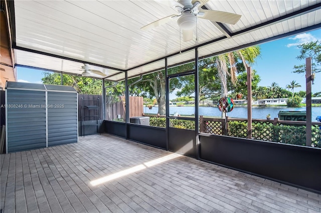10760 Hickory Ave, Pembroke Pines, FL 33026 - unfurnished sunroom with a ceiling fan and a water view