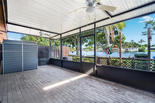 10760 Hickory Ave, Pembroke Pines, FL 33026 - unfurnished sunroom featuring a ceiling fan and a water view