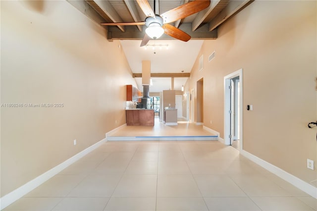 10760 Hickory Ave, Pembroke Pines, FL 33026 - hallway with beamed ceiling, high vaulted ceiling, light tile patterned flooring, and baseboards