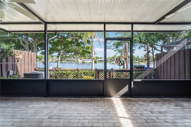 10760 Hickory Ave, Pembroke Pines, FL 33026 - unfurnished sunroom with a water view and a ceiling fan