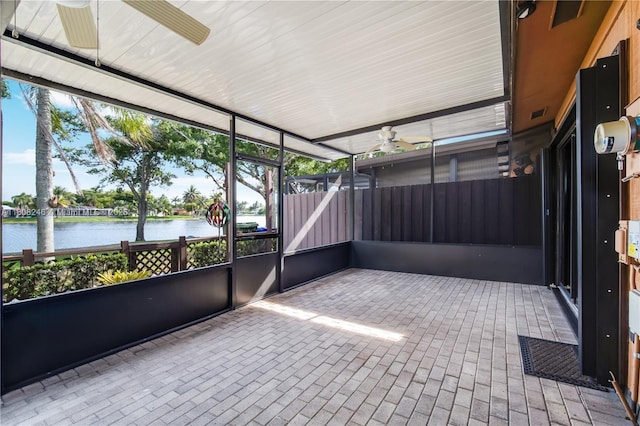 10760 Hickory Ave, Pembroke Pines, FL 33026 - unfurnished sunroom featuring a ceiling fan and a water view