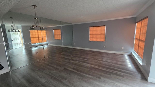 11890 SW 18th Ter Unit 112, Miami, FL 33175 - unfurnished living room with healthy amount of natural light, ornamental molding, a textured ceiling, wood finished floors, and baseboards